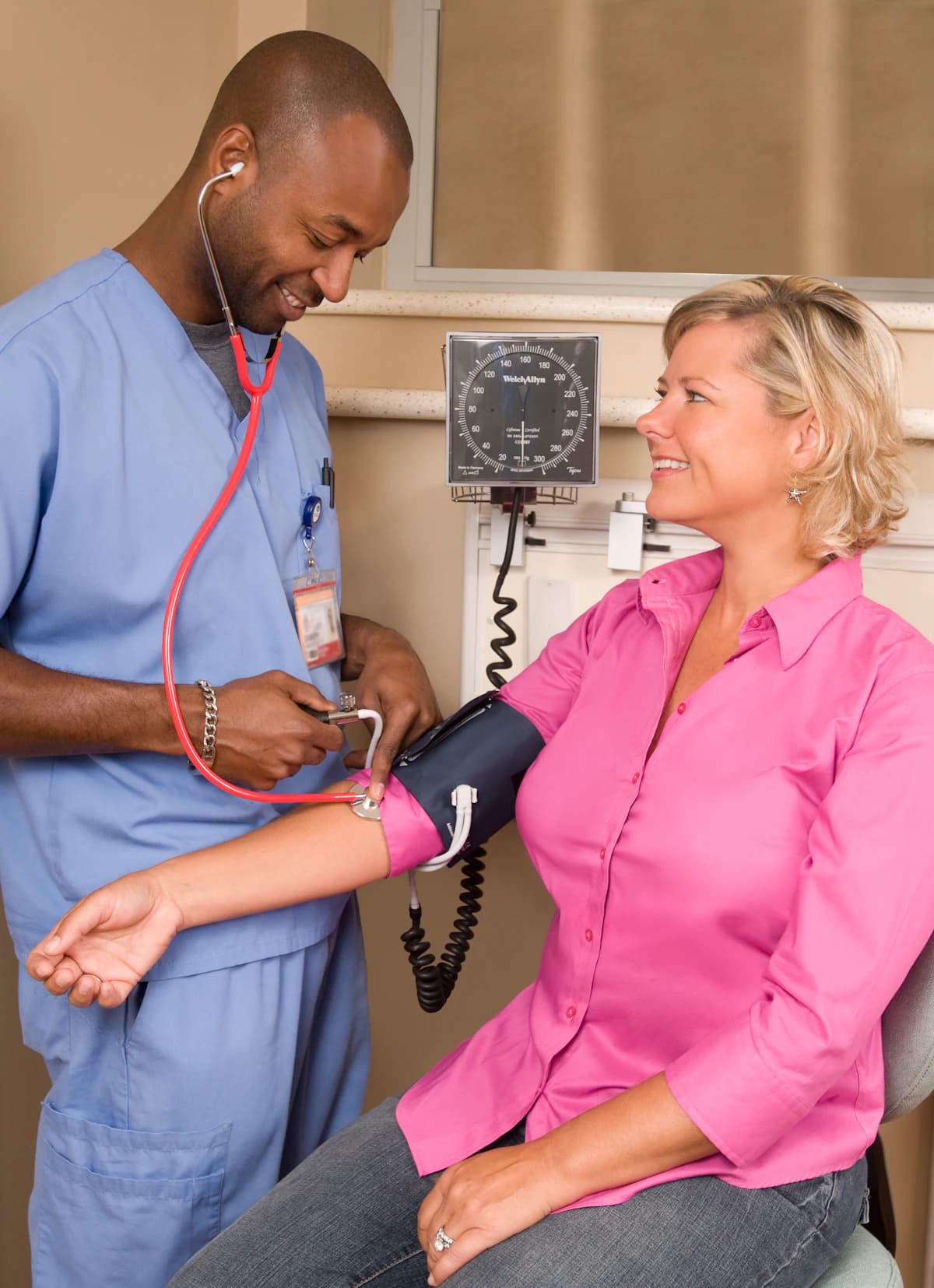 Clinician checking a patient's blood pressure