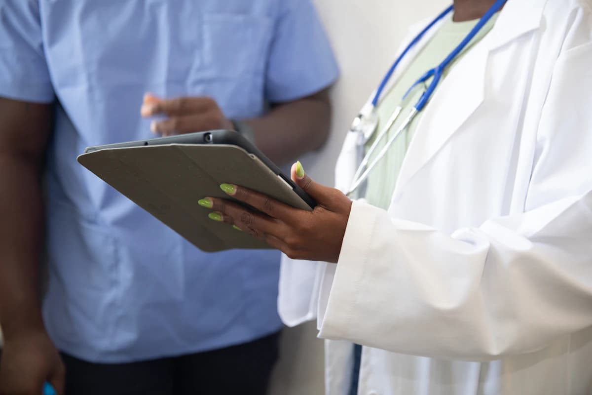 Care team reviewing a treatment plan on a tablet