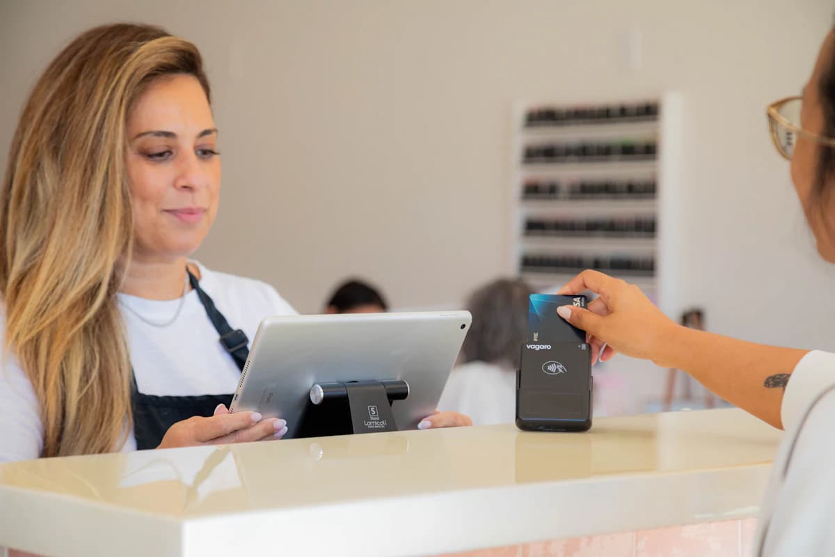 Patient paying a balance at a clinic front desk