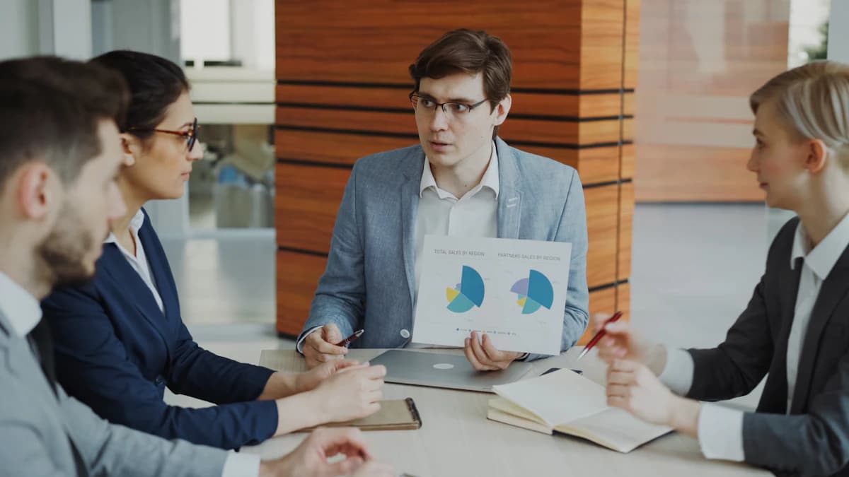 Account manager reviewing performance charts with a client team