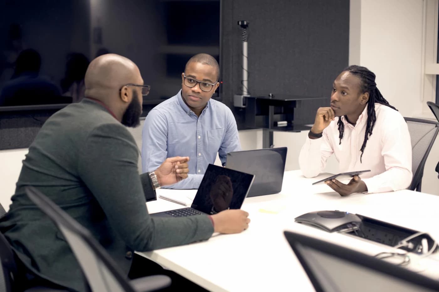 Account managers meeting around a conference table